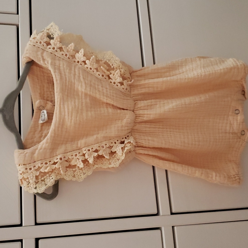 Peach jumper with lace sleeve detail. Size 12-18 months.